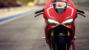 Blaze Through The Air With The Ducati 1199 Panigale R Superbike Wallpaper