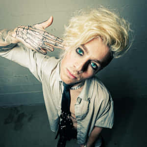 Blonde Haired Personwith Tattooed Hand Wallpaper