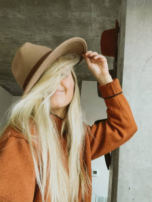 Blonde Hipster In Orange Polo Wallpaper