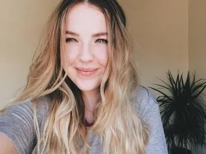 Blonde Smiling Woman Indoor Wallpaper