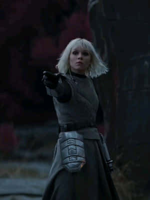 Blonde Warrior Pointing Weapon Wallpaper