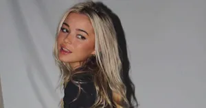 Blonde Woman Glancing Back Wallpaper