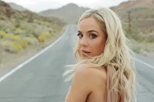 Blonde Woman Roadside Glance Wallpaper