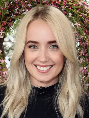 Blonde Woman Smiling Floral Backdrop.jpg Wallpaper