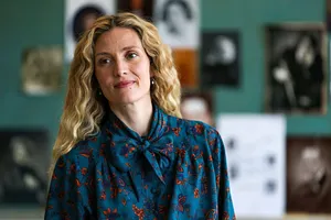 Blonde Womanin Blue Butterfly Blouse Wallpaper