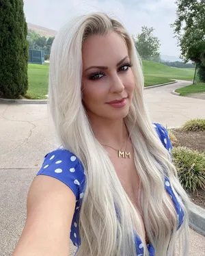 Blonde Womanin Blue Polka Dot Dress Outdoors Wallpaper