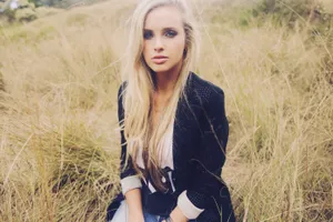 Blonde Womanin Field Portrait Wallpaper