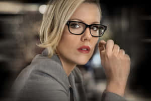 Blonde Womanin Glasses Thoughtful Pose Wallpaper