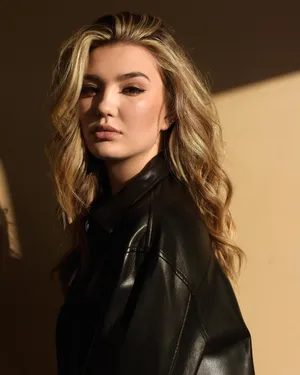 Blonde Womanin Leather Jacket Wallpaper