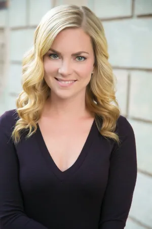 Blonde Womanin Purple Top Smiling Wallpaper