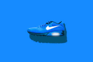 Blue Athletic Sneakeron Blue Background.jpg Wallpaper