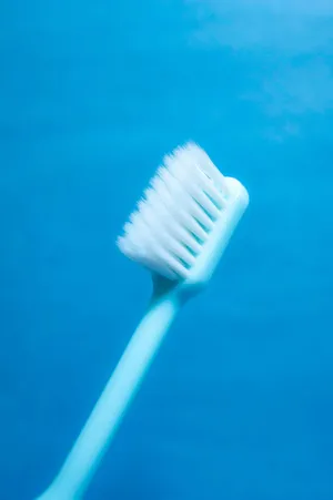 Blue Background Toothbrush Wallpaper