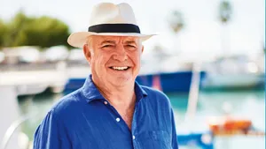 Blue Beach Hat On Golden Seashore Wallpaper