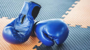 Blue Boxing Gloveson Mat Wallpaper