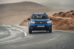 Blue Dacia Duster On Road Wallpaper