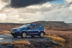 Blue Dacia Duster Rugged Landscape Wallpaper