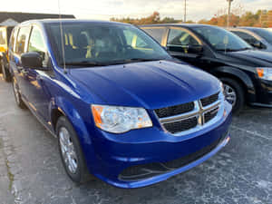 Blue Dodge Grand Caravan Parked Wallpaper