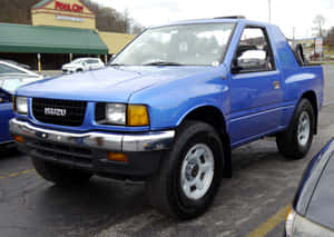 Blue Isuzu Amigo Parked Outdoor Wallpaper