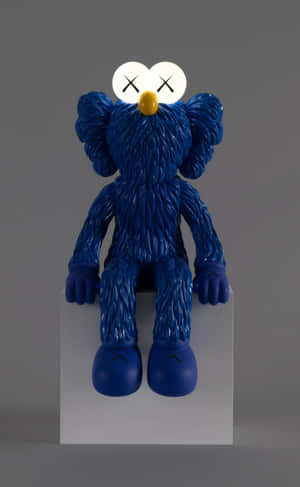 Blue Kaws Figure Sitting Wallpaper