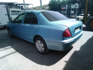 Blue Lancia Lybra Sedan Parked Outdoors Wallpaper