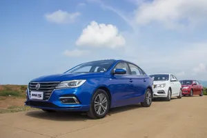 Blue M G5 Sedan Leading Rowof Cars Wallpaper