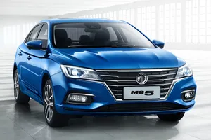 Blue M G5 Sedan Showroom Wallpaper