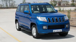 Blue Mahindra T U V300 On Road Wallpaper