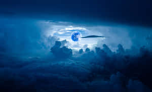Blue Moon Among Clouds Wallpaper