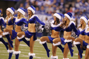 Blue Santa Hats On Cheerleader Wallpaper