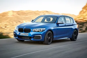 Bmw 1 Series Showcasing Its Sleek Design And Power Wallpaper