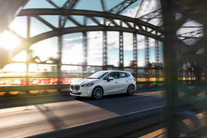 Bmw Luxury Car On A Bridge Wallpaper