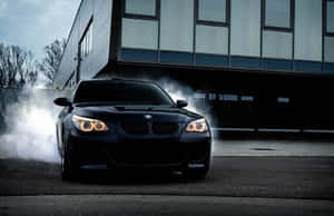 Bmw M5 Speeding On Road Wallpaper