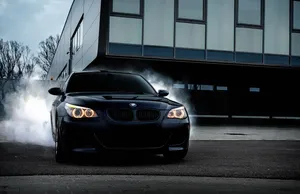 Bmw M5 Speeding On Road Wallpaper