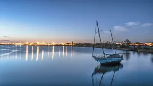 Boat Against City View Wallpaper