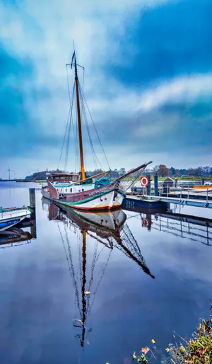 Boat Reflection In Calm Water Wallpaper
