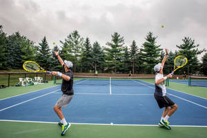 Bob Bryan Serve With Brother Mike Wallpaper