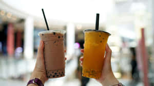 Boba Tea Varieties Held Up Wallpaper