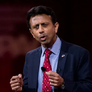 Bobby Jindal Answering A Question At A Press Conference Wallpaper