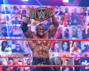 Bobby Lashley Holding His Championship Belt Over His Head Wallpaper
