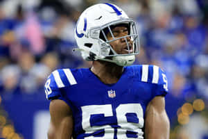 Bobby Okereke In Action During A Football Game Wallpaper