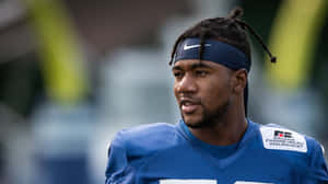 Bobby Okereke In Action On The Field Wallpaper