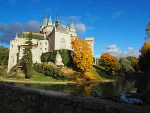 Bojnice Castle Surrounded Water And Grass Wallpaper