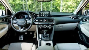 Bold And Dynamic Genesis G70 On The Road Wallpaper