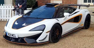 Bold And Powerful Mclaren 620r On Race Track Wallpaper