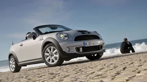 Bold Mini Roadster In Vibrant Urban Setting Wallpaper