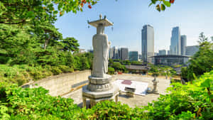 Bongeunsa Temple Statue Overlooking Seoul Skyline Wallpaper