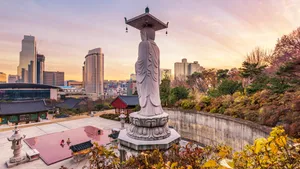 Bongeunsa Temple Statue Overlooking Seoul Skyline Wallpaper