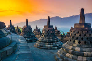 Borobudur Temple Under Orange Sky Wallpaper