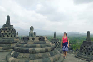 Borobudur Temple Woman Near Statue Wallpaper