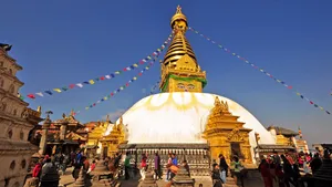 Boudhanath Stupa Under A Clear Sky Wallpaper